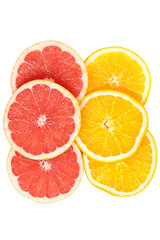 Slices of various citruses on white