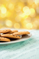chocolate chip cookies on blue table set with bokeh background