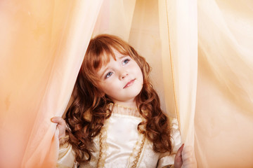 Vintage potrait of a beautiful girl with braided hair wearing summer sundress. Children fashion. Retro style.