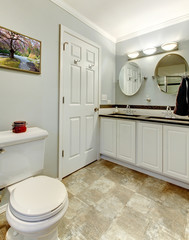 Modern new clean bathroom with grey and white.