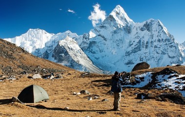 Ama Dablam with tent and man