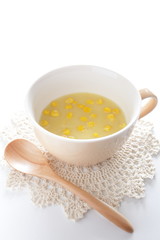 Corn soup and wooden spoon
