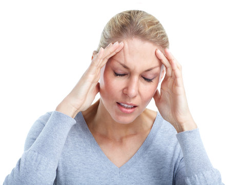 Young woman having a headache. Stress.