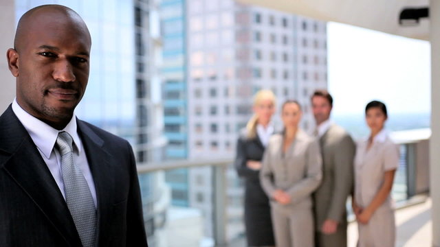 Successful Ethnic Business Eexecutive with his Team