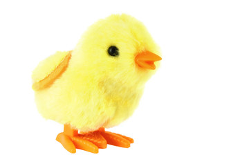 bright toy clockwork fluffy yellow chick isolated on white