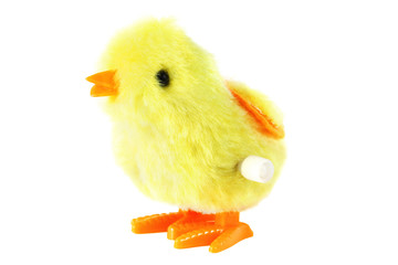 bright toy clockwork fluffy yellow chick with orange feet