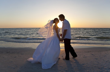 Bride & Groom Married Couple Kissing Sunset Beach Wedding