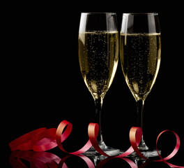 Two glasses with white wine over black background - 37390581