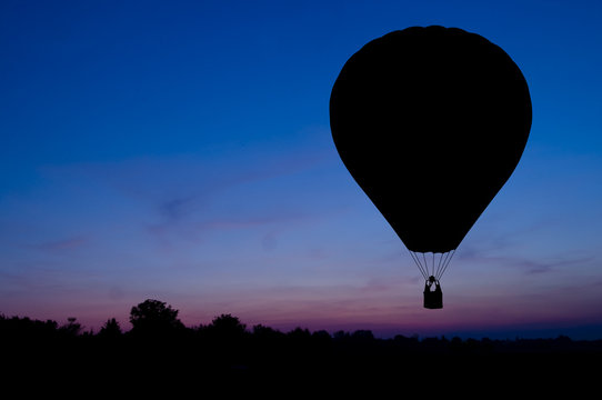 Silhouette of the balloon on a sunset background.