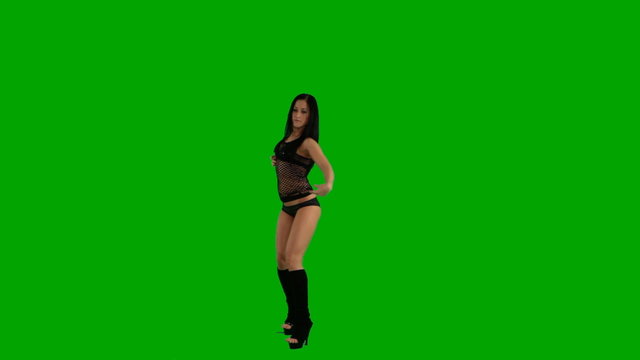 Beautiful young girl dancing against green screen