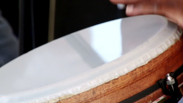 Man playing Afro percussion, conga