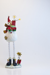 Christmas card. Snowman with gift boxes