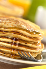 Fresh homemade pancakes with maple syrup