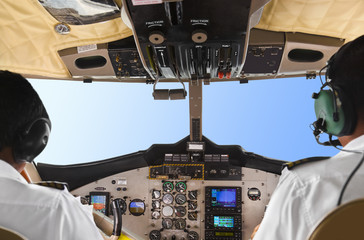 Pilots in the plane cockpit and sky