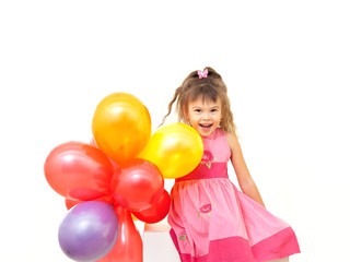 Fototapeta na wymiar Little smiling girl with a bunch of bright balloons