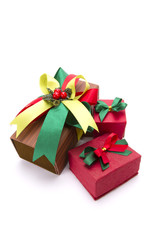 three gift boxes brown and red and ribbon Christmas theme.