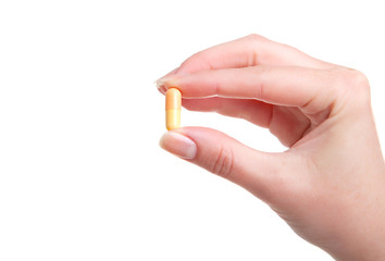 pill in a hand on white background