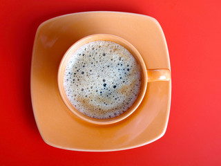 Coffee cup on a red background