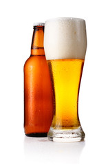 Bottles and full glass of beer isolated