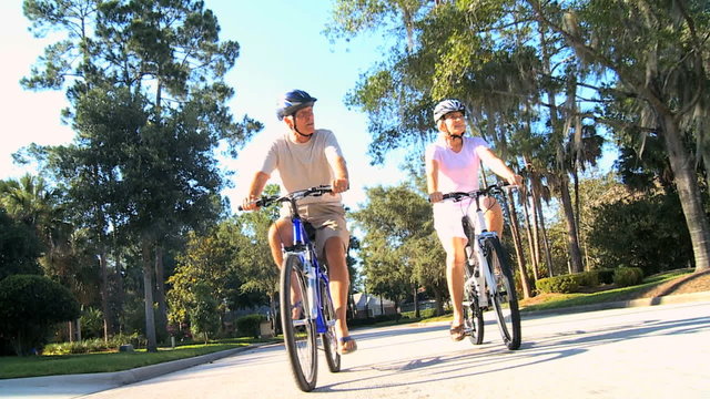Senior Couple Keeping Fit by Cycling