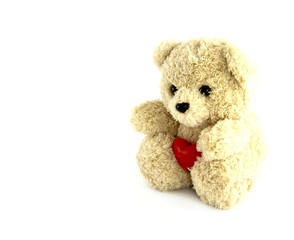 teddy bear toy with heart on white background