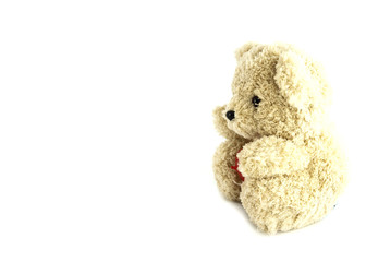 teddy bear toy with heart on white background