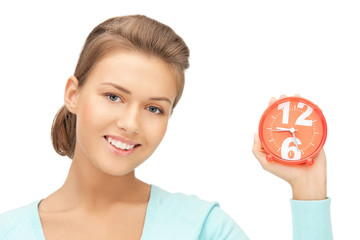 woman holding alarm clock