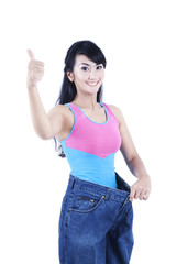 Beautiful asian womans showing her thumb-up