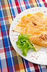 Pumpkin stuffed panckes in the plate