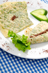 Pancake with herbs in the plate