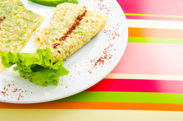 Pancake with herbs in the plate