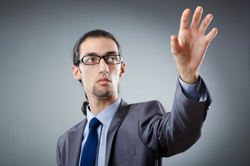 Businessman pressing virtual buttons