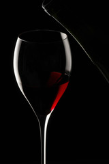 red wine glass isolated on black background