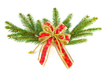 christmas tree branch with red ribbon