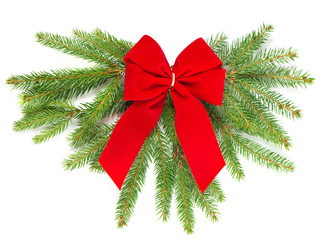 christmas tree branch with red ribbon