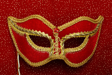 photo of theatrical mask on red background
