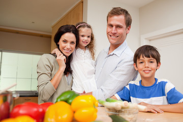 Family standing in the kitchen