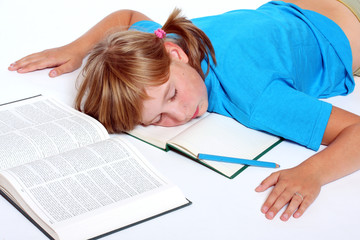 Tired schoolgirl with book.