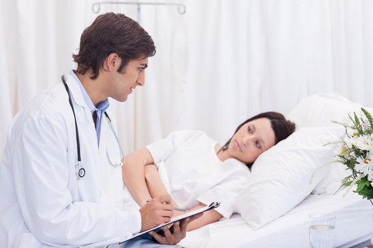 Doctor talking to his patient that just woke up