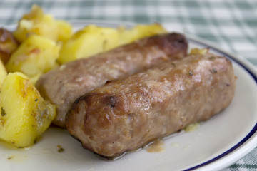 detail of sausages with potatoes