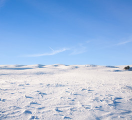 snow hill and blue sky