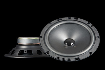 two car speakers shown from the front and side