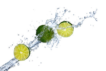Fresh limes falling in water splash,isolated on white background