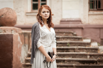 Redhead girl at  park. Photo in old image style.