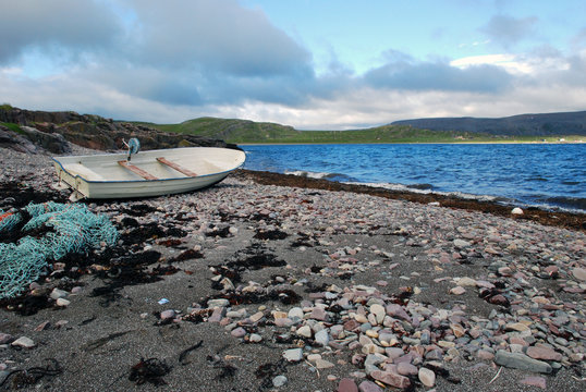 Lonaly boat at abandoned fishing village Hamningberg in Finnmark
