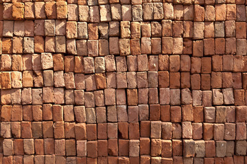 red stapled bricks give a harmonic pattern in the sun