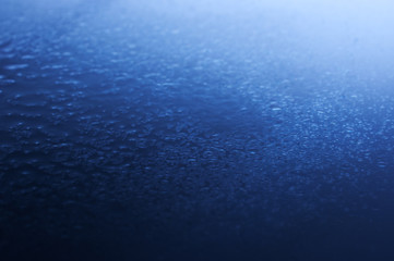 Spray water on a blue background