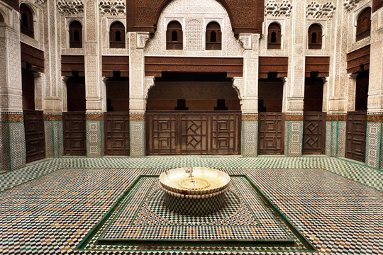 Interior Madrasa courtyard with tiled fountain in center