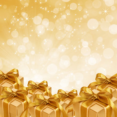 gold gift box on abstract gold Christmas background