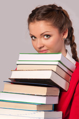 girl sitting in front of books